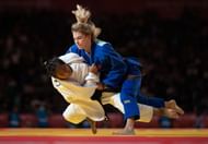 Thangjam of India in action against Ana Viktorija Puljiz of Croatia